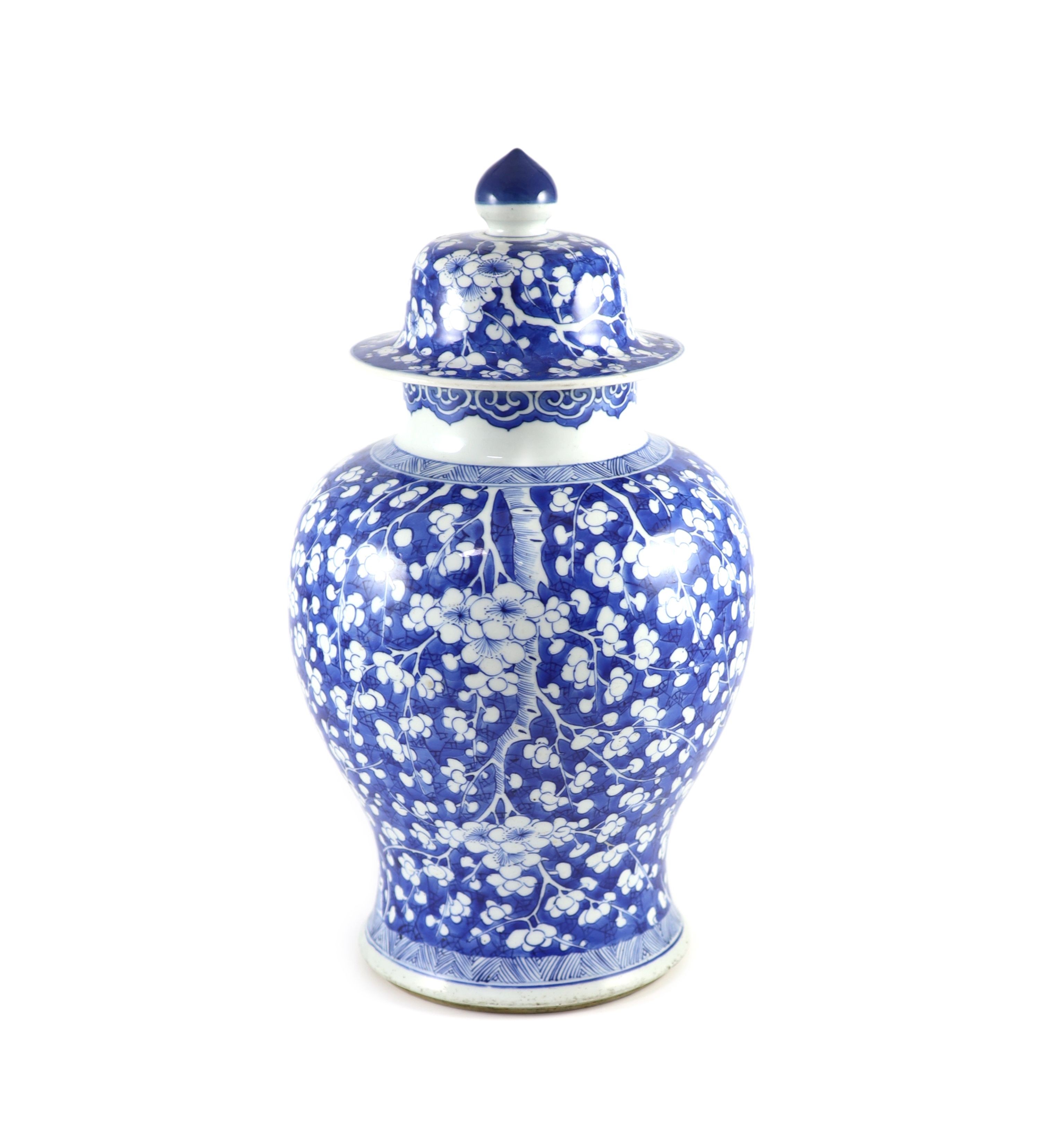 A good Chinese blue and white ‘prunus and cracked ice’ vase and cover, Kangxi period